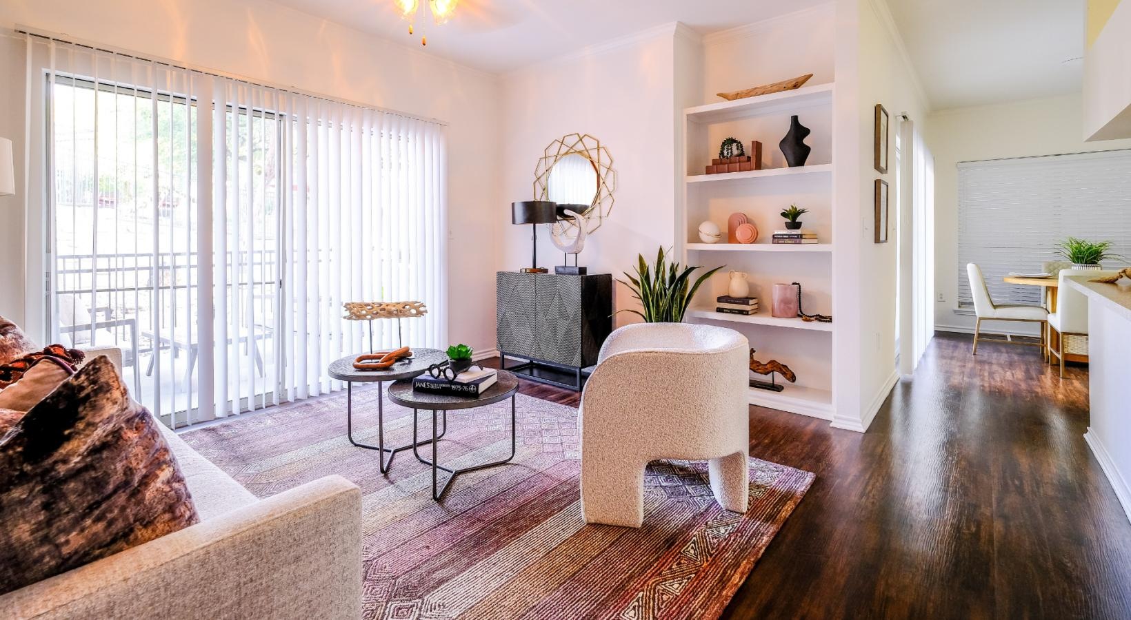 Wide open living areas flooded with natural light living room with access to private patio