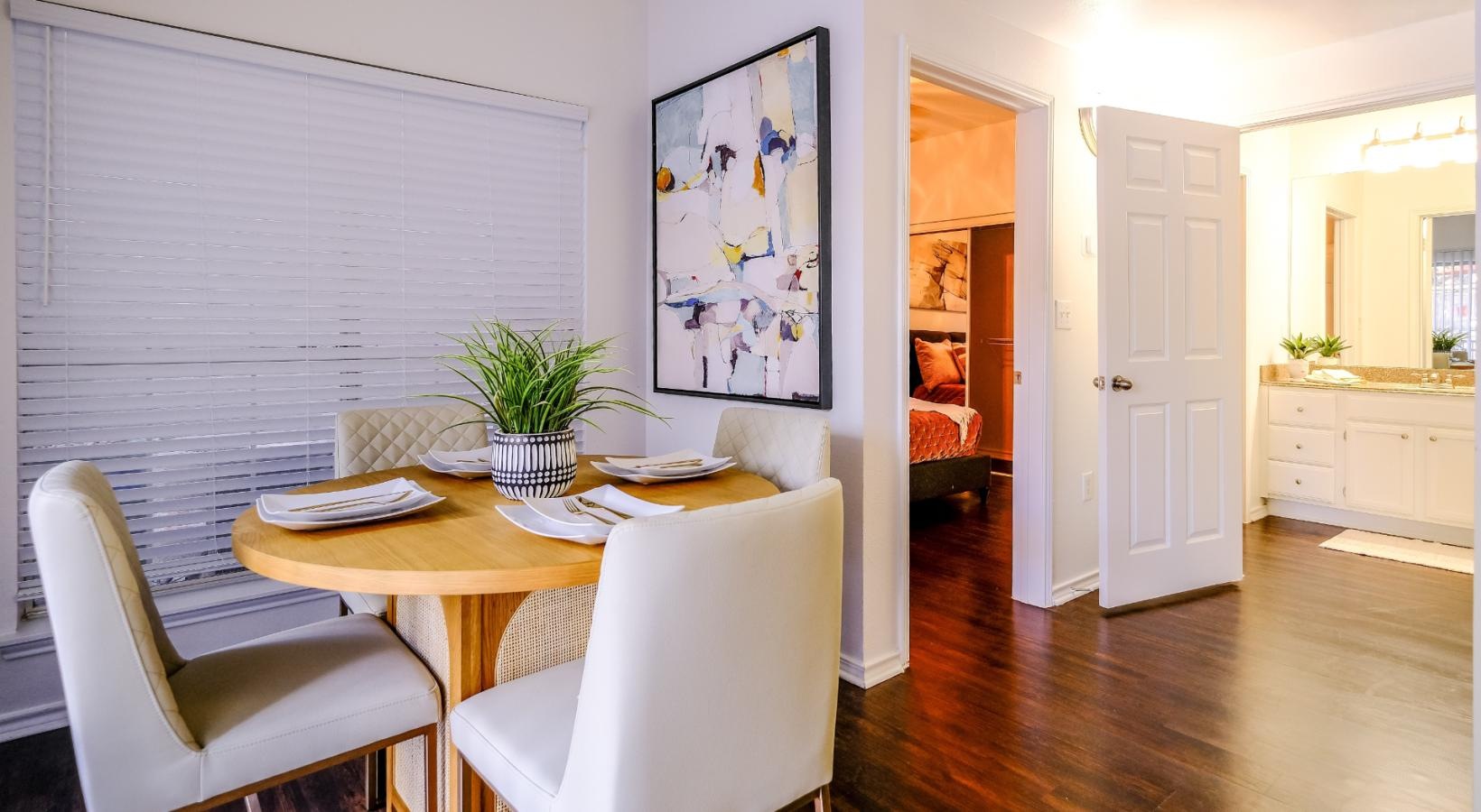 Generous living spaces to relax and unwind a dining room with a table and chairs