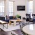 living room area with a tv and couches in clubhouse