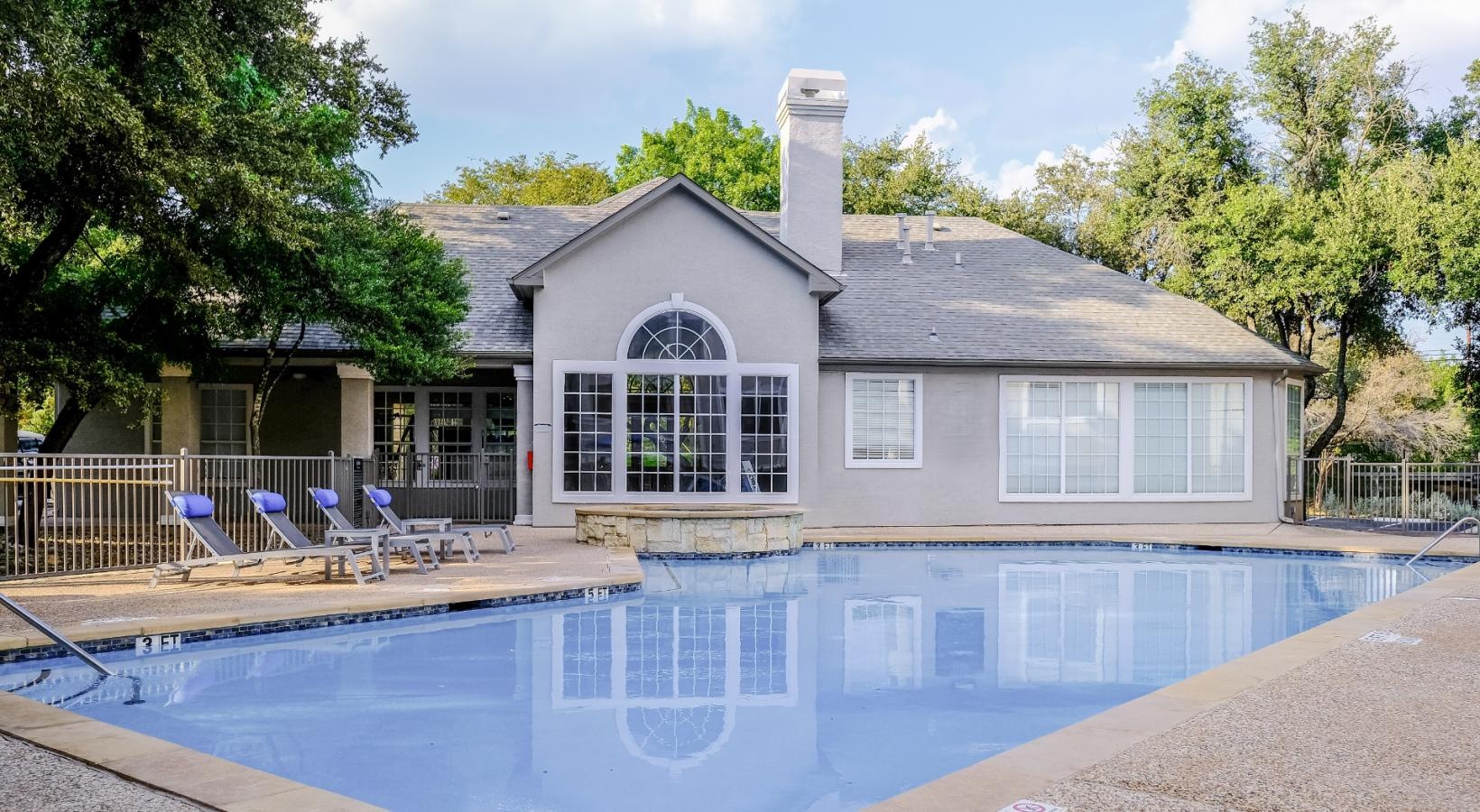 Shimmering resort-style pool outdoor swimming pool