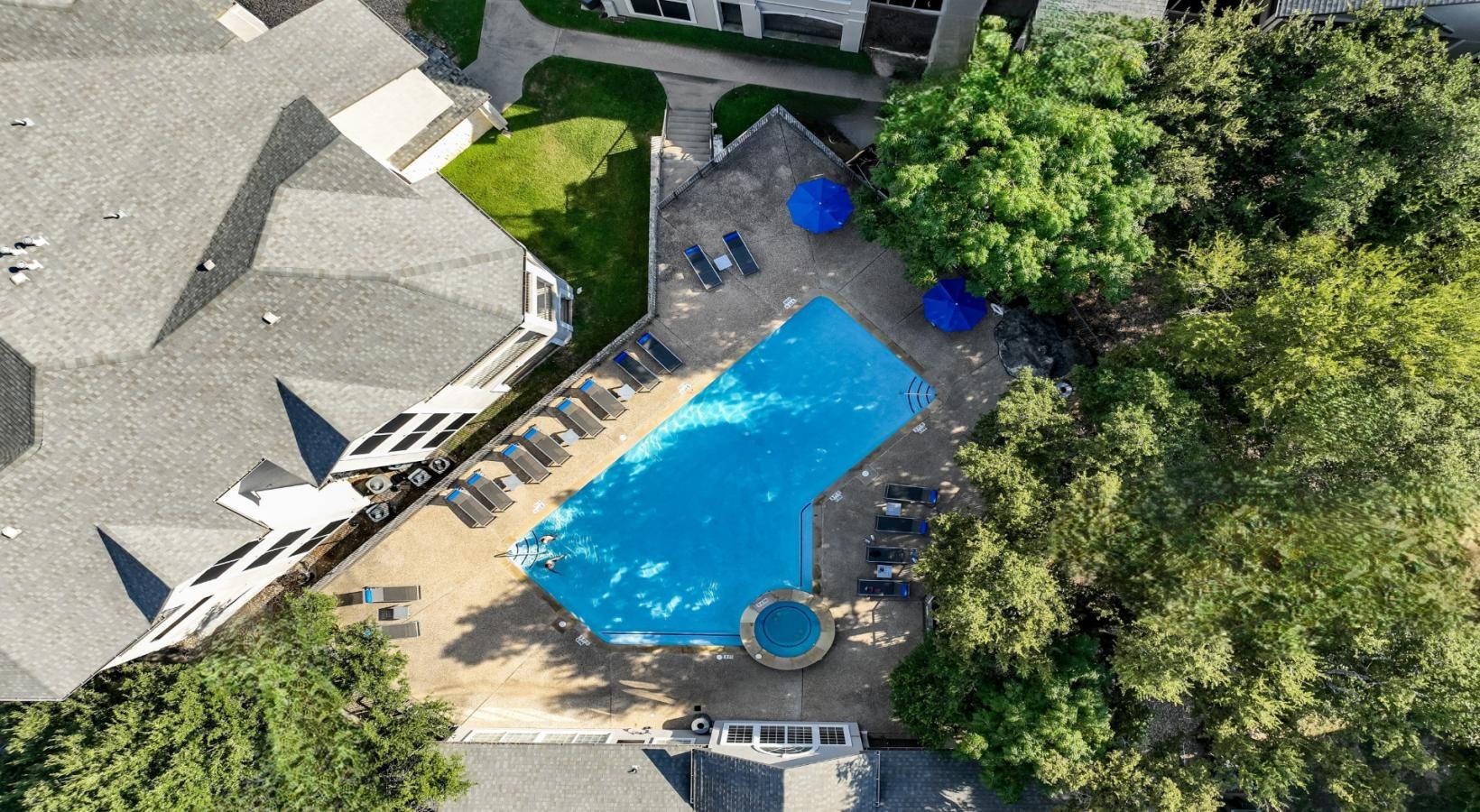 Shimmering resort-style pool a pool in a courtyard