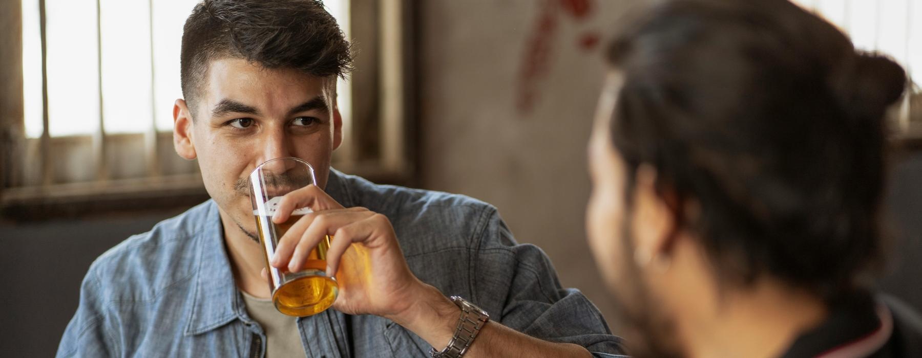 men drinking beer in a pub