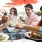 a group of people eating at a restaurant