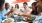 a group of people eating at a restaurant