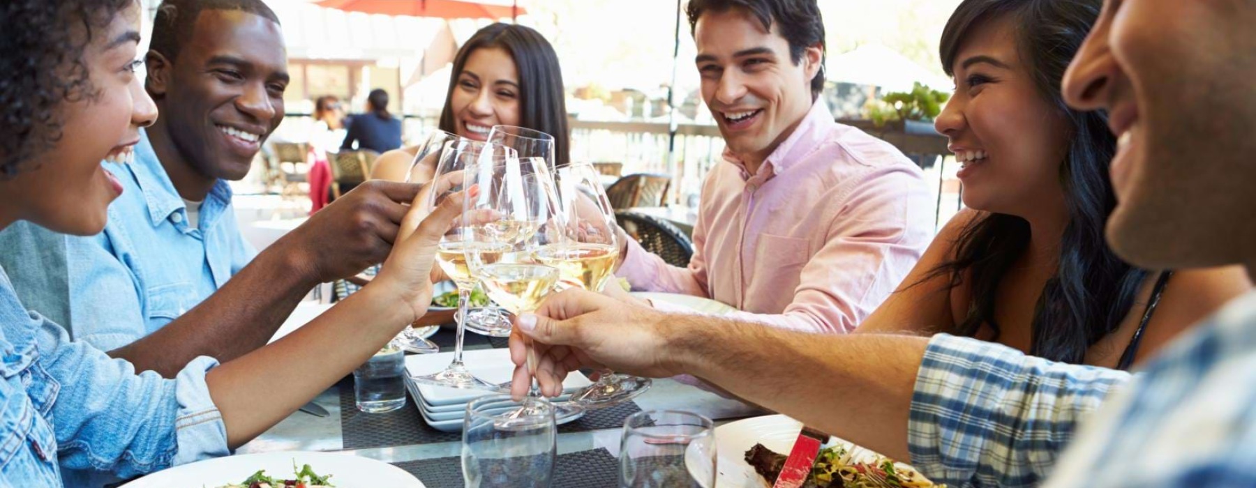 a group of people eating at a restaurant