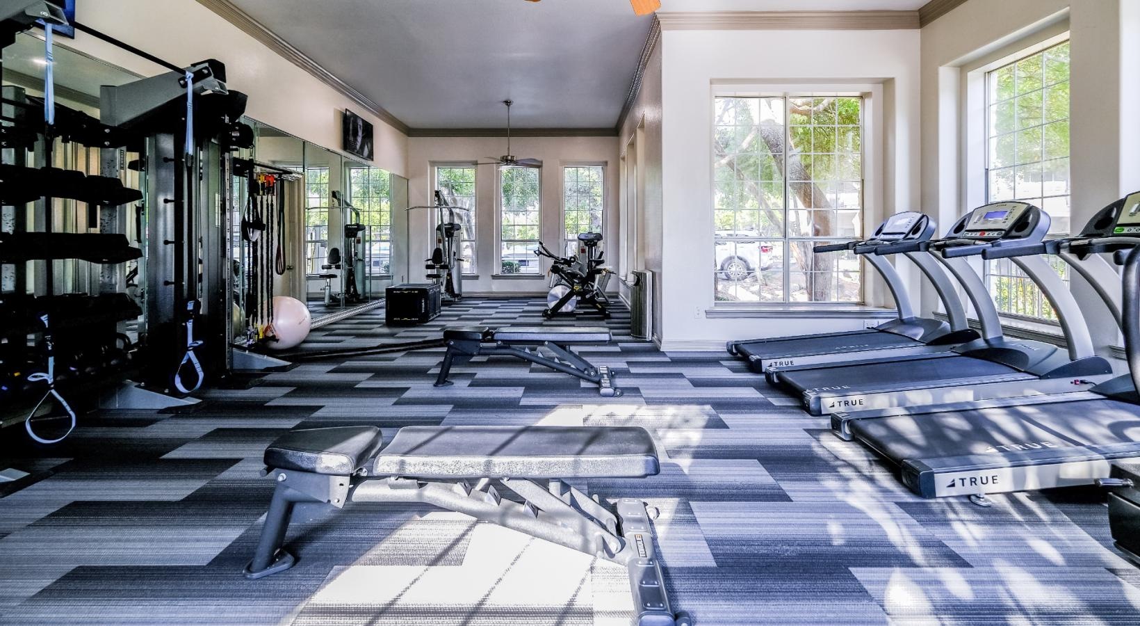 Cutting-edge amenities at your fingertips a gym with treadmills